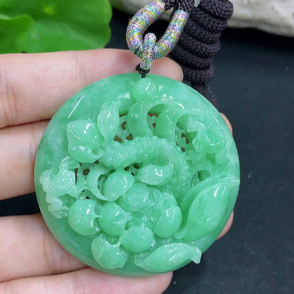 HKHQ jadeite lotus pendant necklace with rope, approximately 48.61g, showcasing a detailed carved jadeite lotus design.