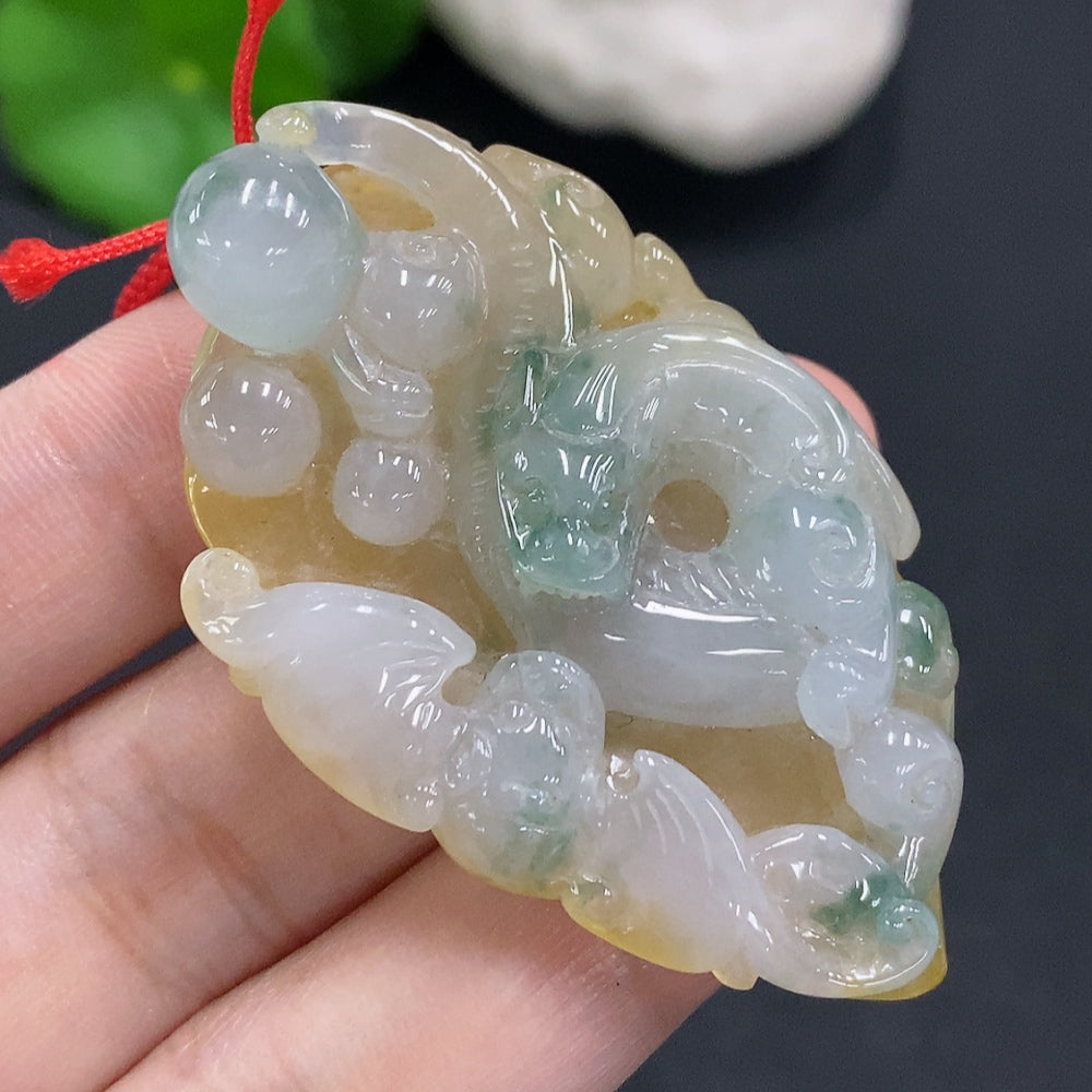 Jadeite pendant with cord, total weight approximately 25.2g (color origin undetermined)