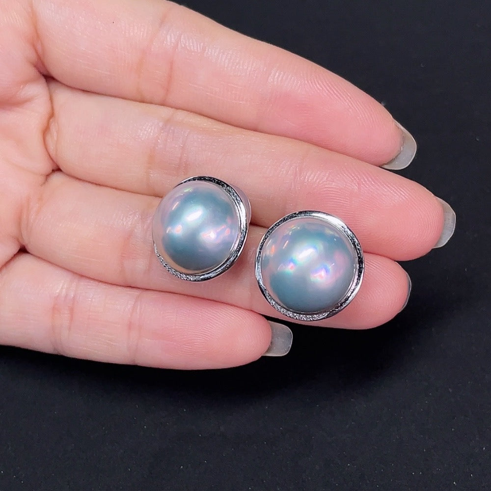 HKHQ composite saltwater pearl stud earrings with platinum setting and diamond accents, featuring elegant jewelry design