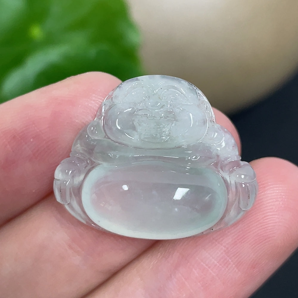 Jadeite Buddha pendant with detailed carving, weighing approximately 4.10g, showcasing smooth green jade from HKHQ.