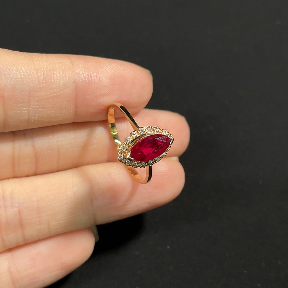 18K gold Ruby ring with diamond accents, elegant jewelry featuring vibrant red gemstones and sparkling diamond details.