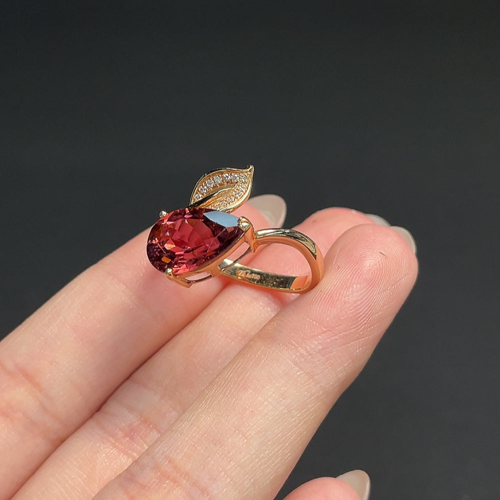 18K gold tourmaline and diamond accent ring, adjustable, weighing approximately 4.29g, featuring vibrant gemstones and elegant design.