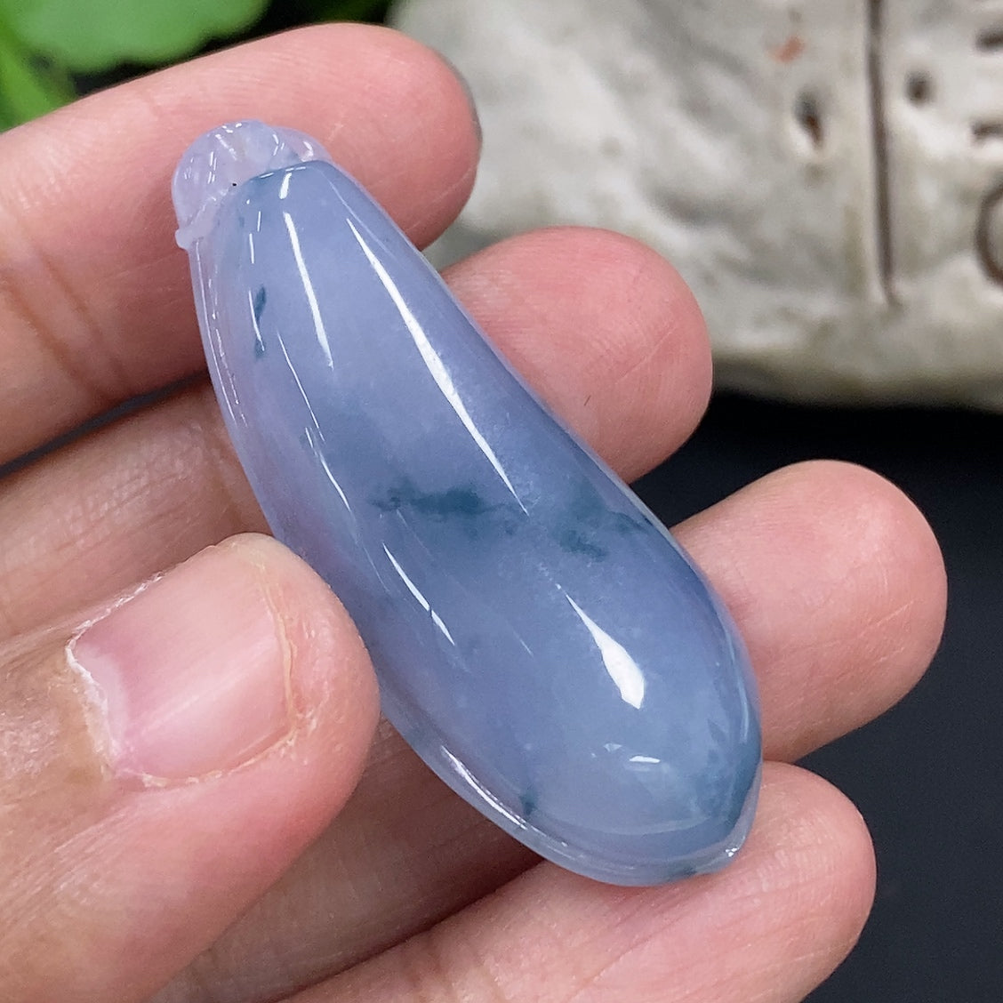 Jadeite auspicious gourd pendant from HKHQ, featuring smooth green jade with carved details, weighs approximately 10.4g.