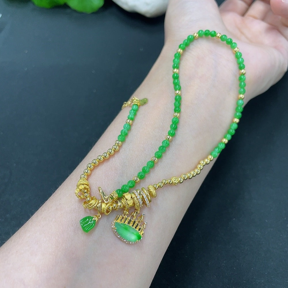 Jadeite pendant with 18K gold and diamond accents, showcasing a polished green jade stone on a delicate chain.