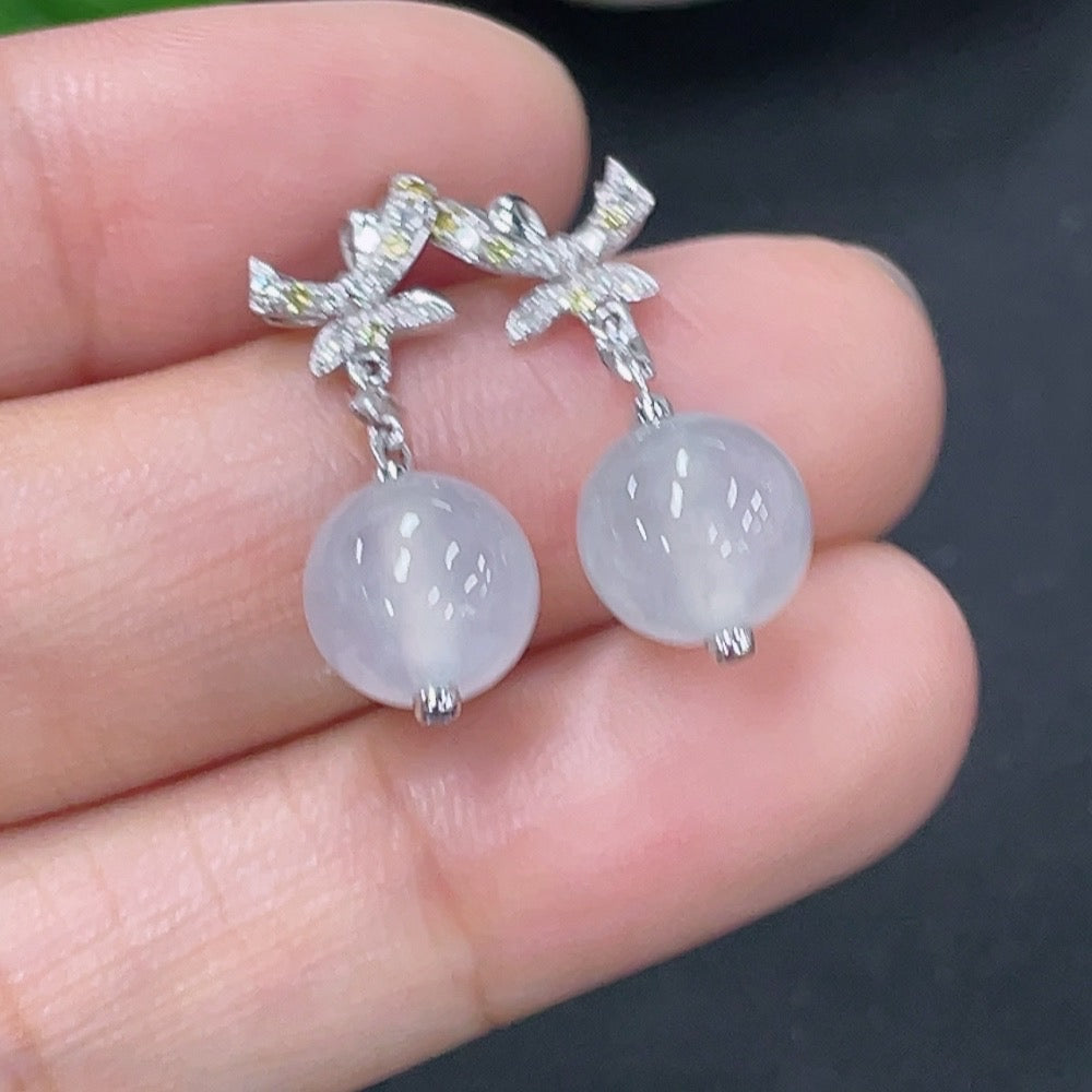 Jadeite earrings set in 18k gold with diamond accents, total product weight approximately 3.07g