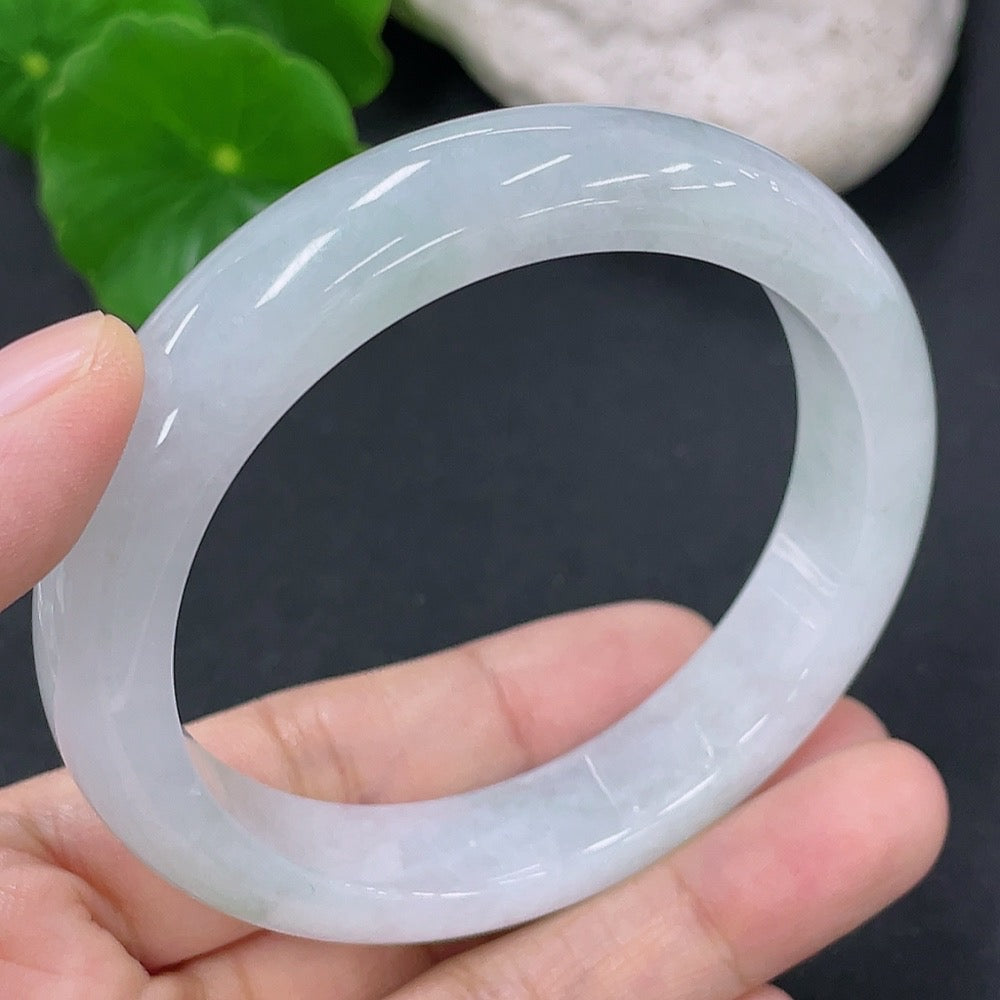 Jadeite round bangle from HKHQ, 54.5mm size, smooth polished surface, showcasing vibrant green jade with natural variations.