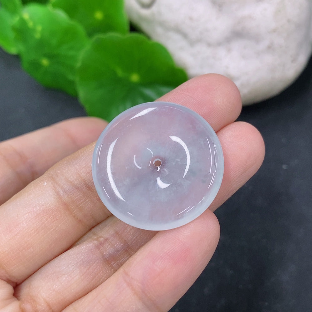 Jadeite pendant featuring a Peace Knot design, crafted by HKHQ, weighing approximately 6.72 grams, with a smooth, polished surface.