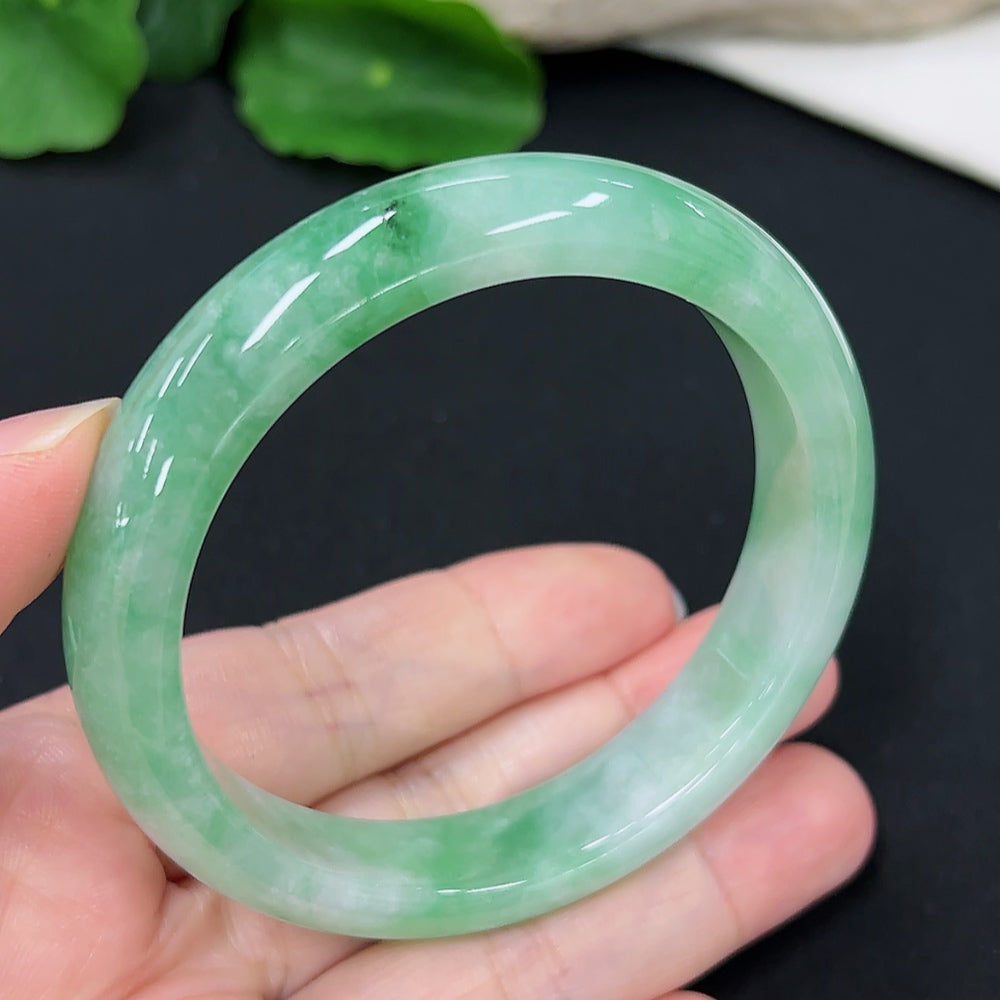 Jadeite round bangle in size 55.1 with approximately 50.4g weight, showcasing smooth, polished jade bracelet with vibrant green hue.