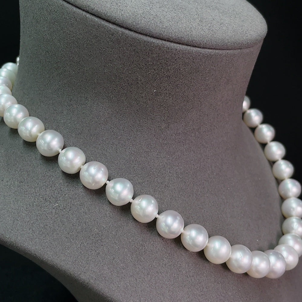 Seawater pearl strand by HKHQ featuring non-gold pearls, 8.9-11.6mm size, total weight approximately 63.95g, arranged in a row.
