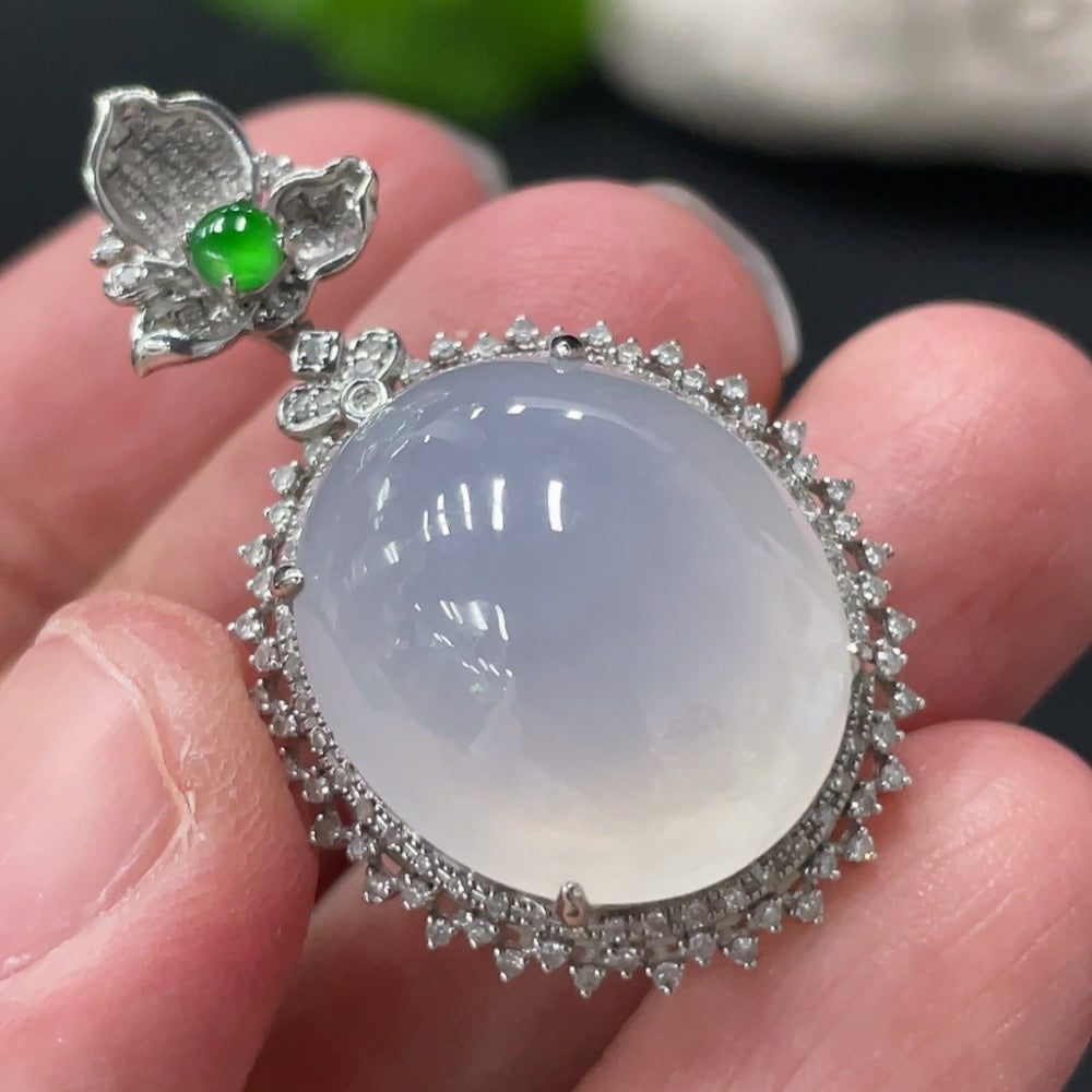 HKHQ Jadeite cabochon pendant with diamond accents, featuring a polished green jade stone and elegant design.
