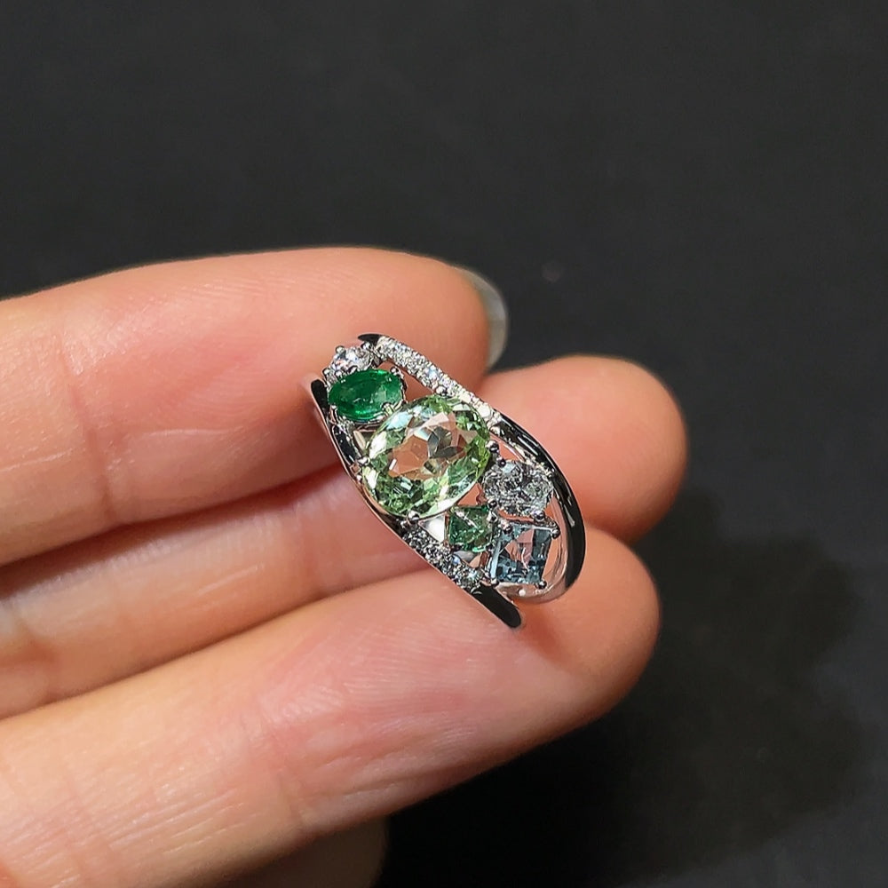 HKHQ gemstone tourmaline ring featuring a large, vibrant tourmaline stone set in a silver band.