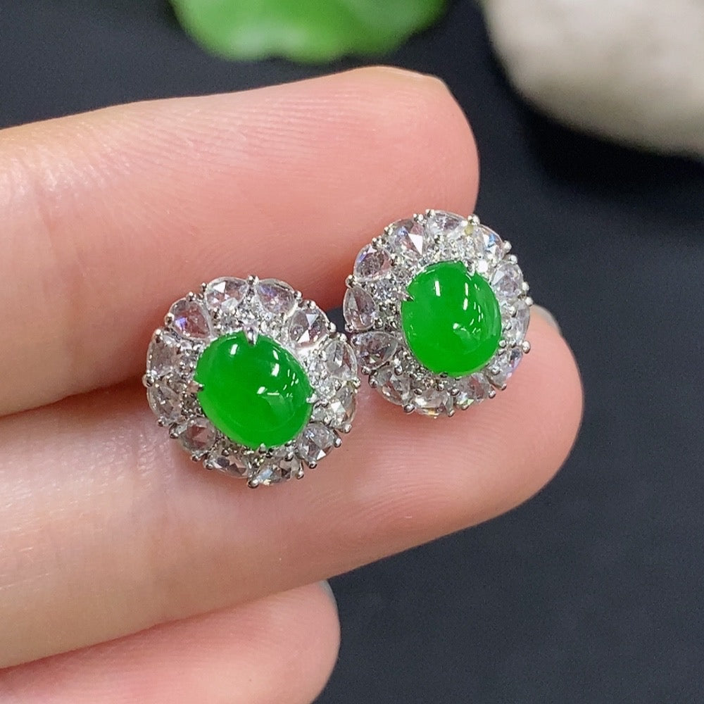 Jadeite earrings with 18k gold and diamond accents, showcasing polished green jade stones and elegant gold settings.