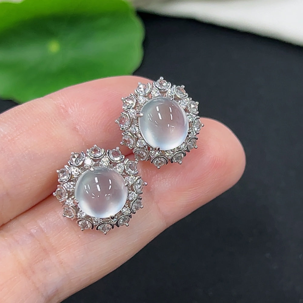 Unmarked jadeite earrings with 18k gold and diamond accents, weighing approximately 4.9g, showcasing elegant jewelry design.