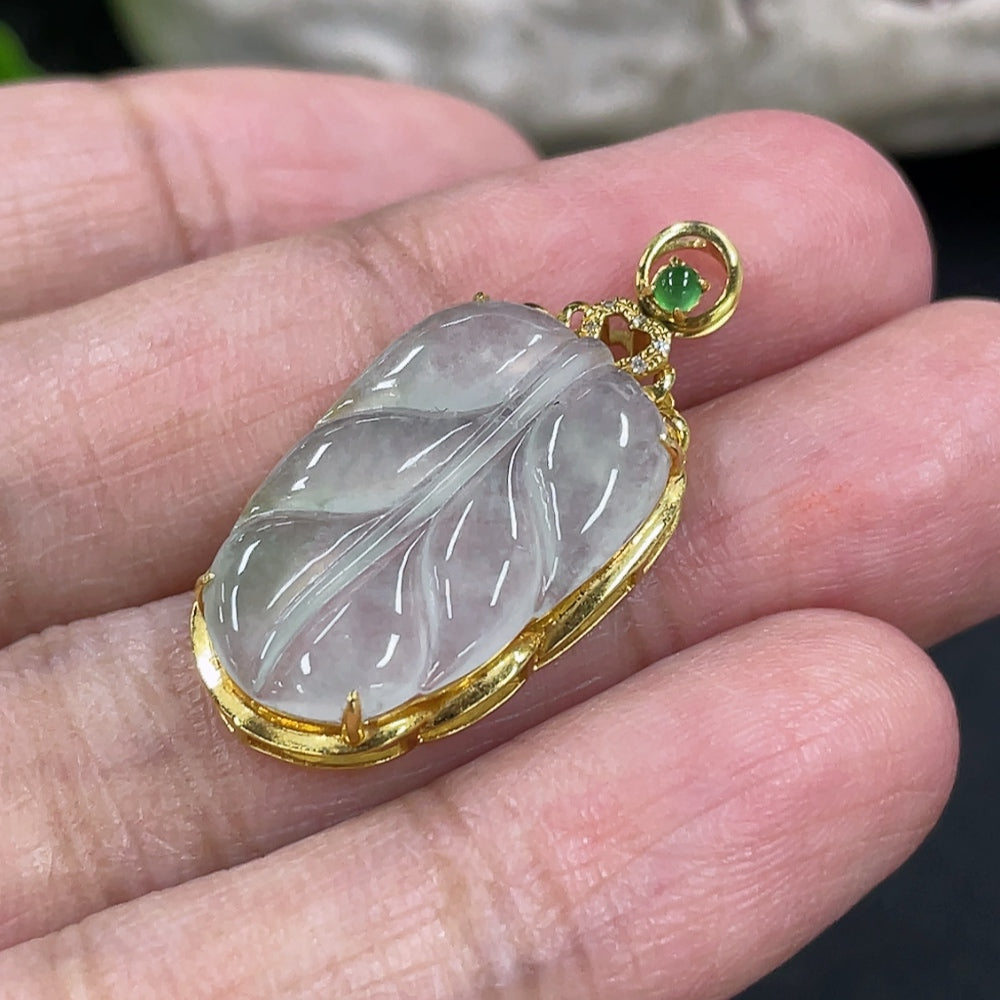 Jadeite leaf pendant in 18k gold with diamond inlays, weighing approximately 2.17g, crafted by HKHQ.