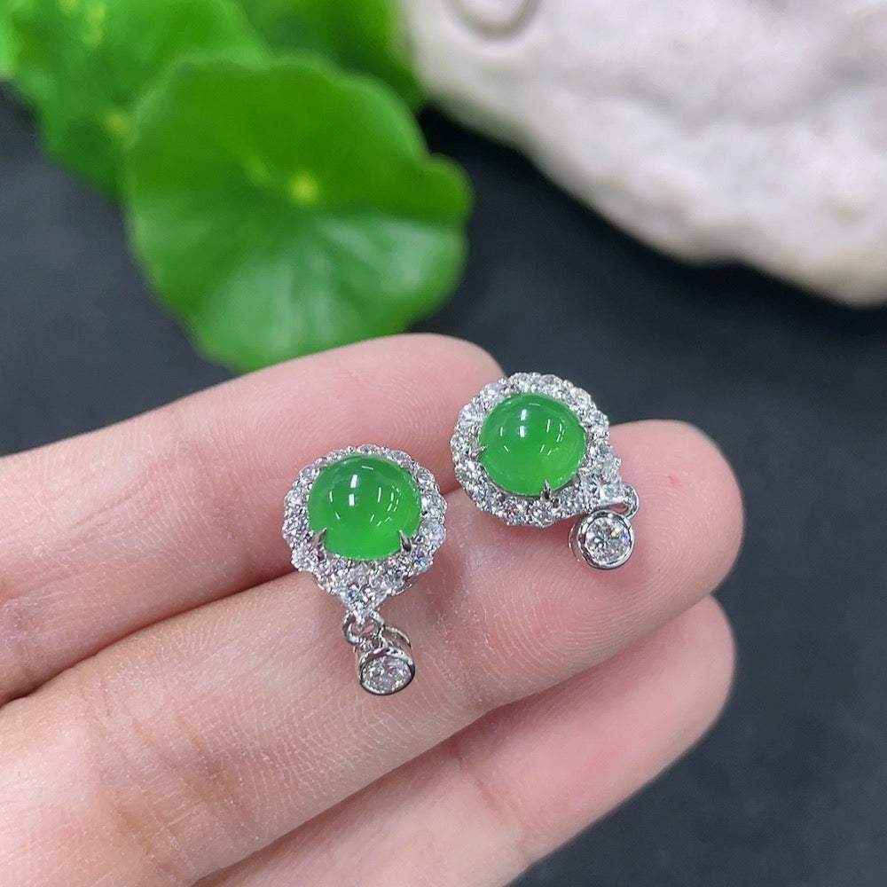 HKHQ jadeite earrings set in 18k gold with diamond accents, showcasing elegant jewelry design and shimmering gemstones.