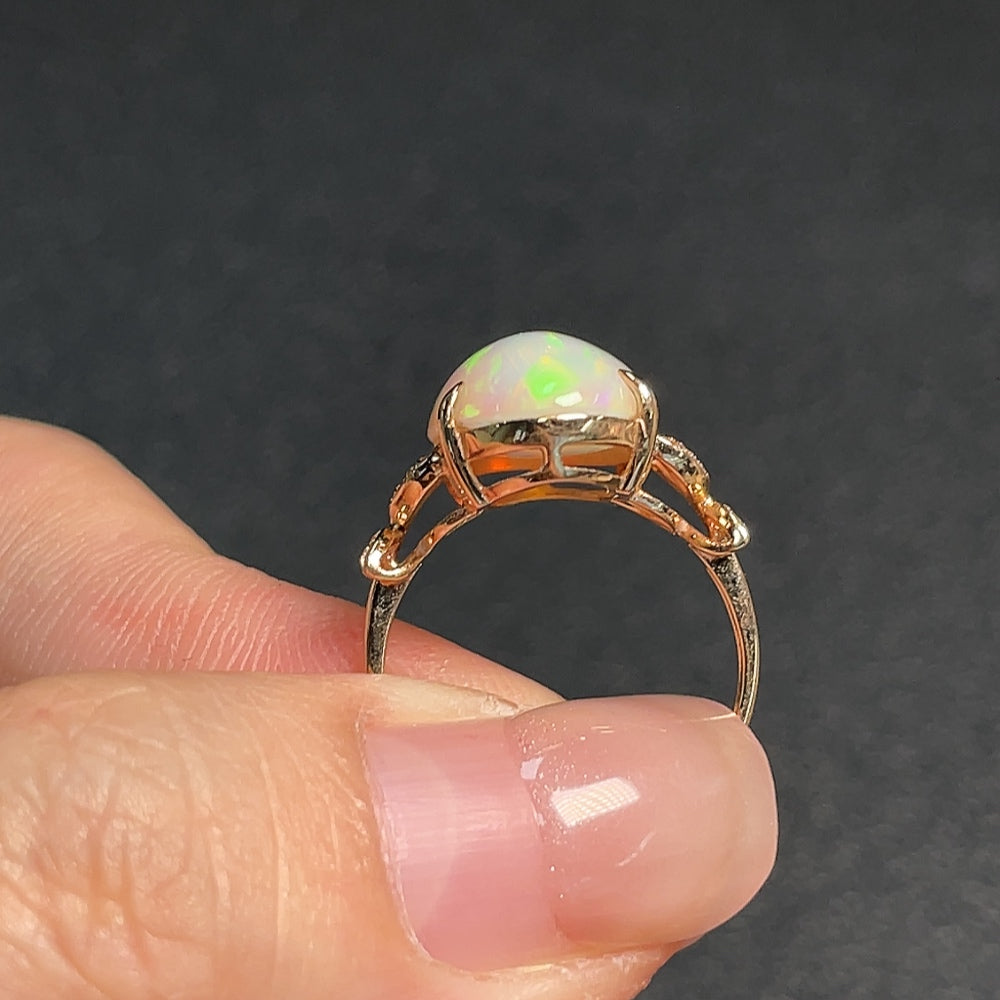 Opal ring with diamond accents, 73% gold content, total weight approximately 3 grams, size 11