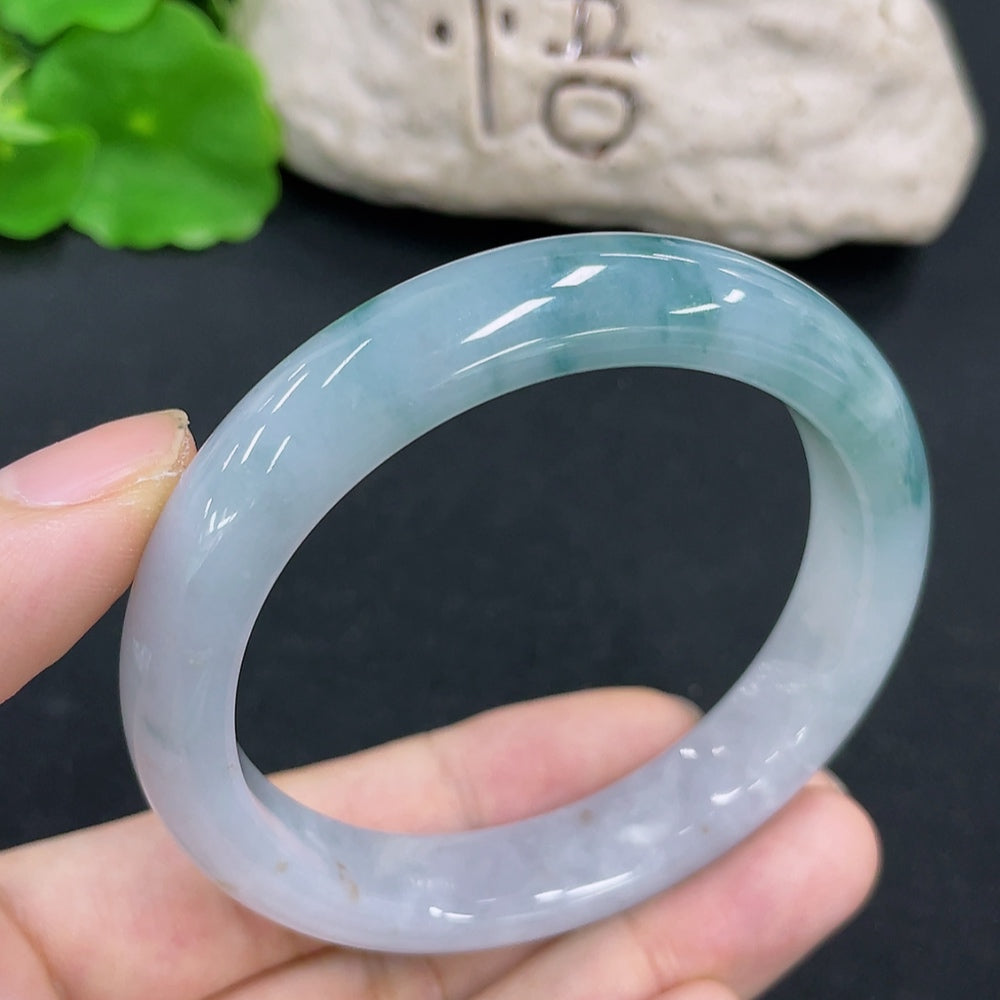 HKHQ jadeite round bangle with a 54.4mm size and 49.3g weight, showcasing smooth, polished green jadeite jewelry.