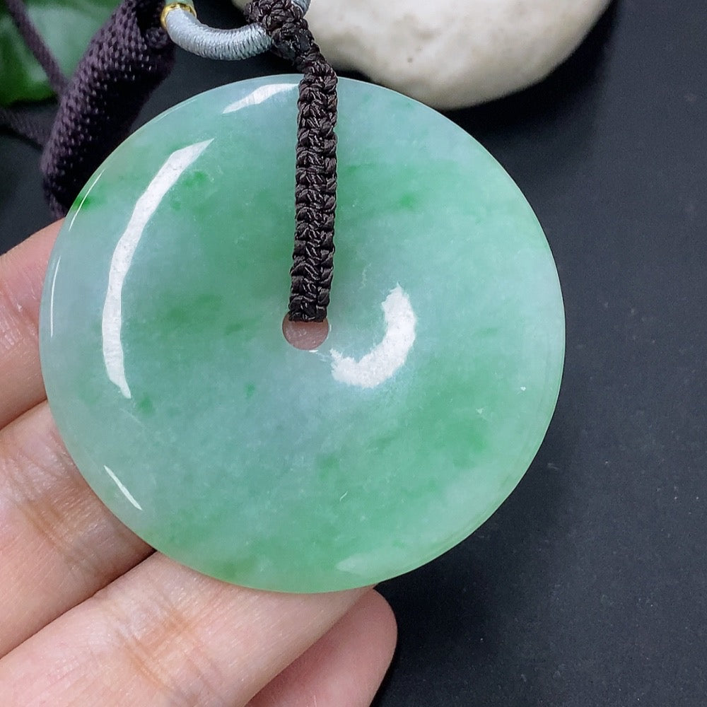 Jadeite pendant featuring a peace knot design with cord, weighing 28.34g, crafted by HKHQ.