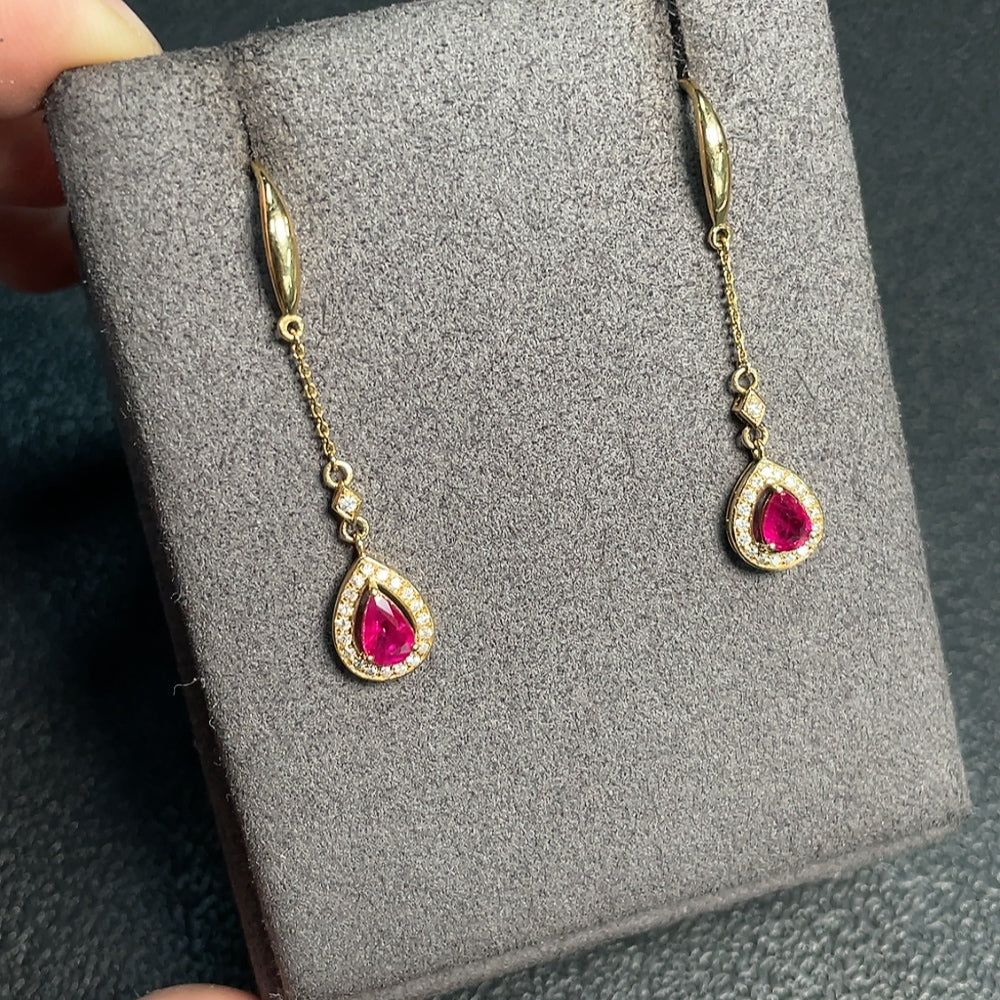 Ruby earrings with diamond accents, filled, gold content Au73%, total weight approximately 2.16g