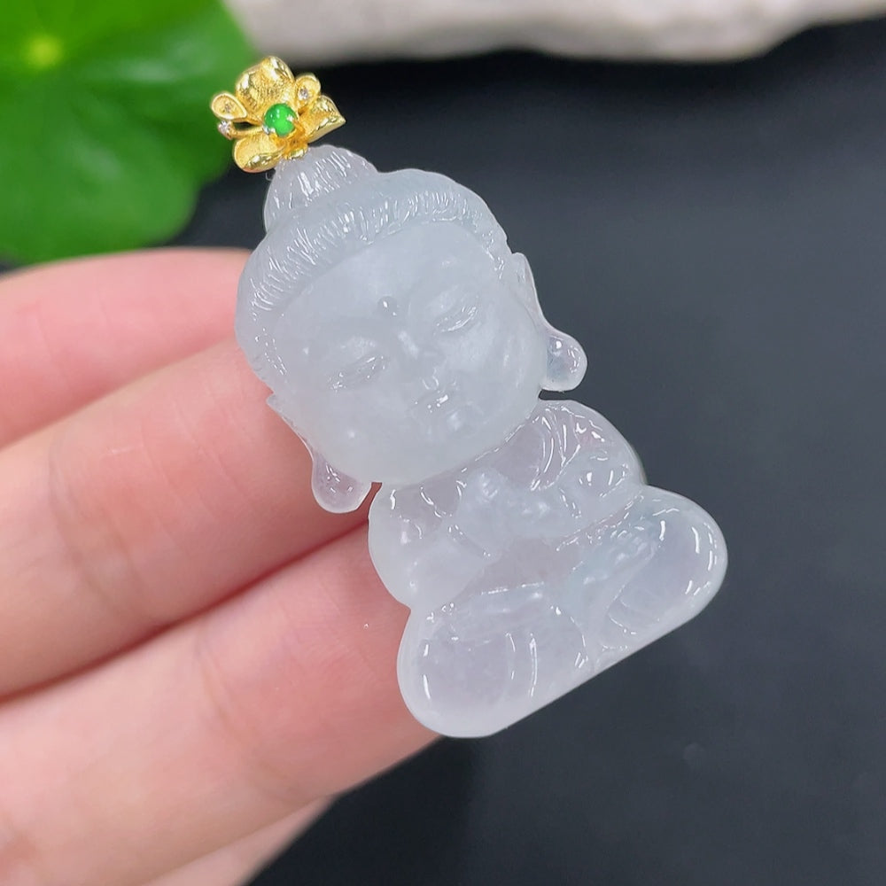 Jadeite pendant featuring a Baby Buddha with 18K bezel and diamond accents, showcasing detailed craftsmanship and smooth jade surface.