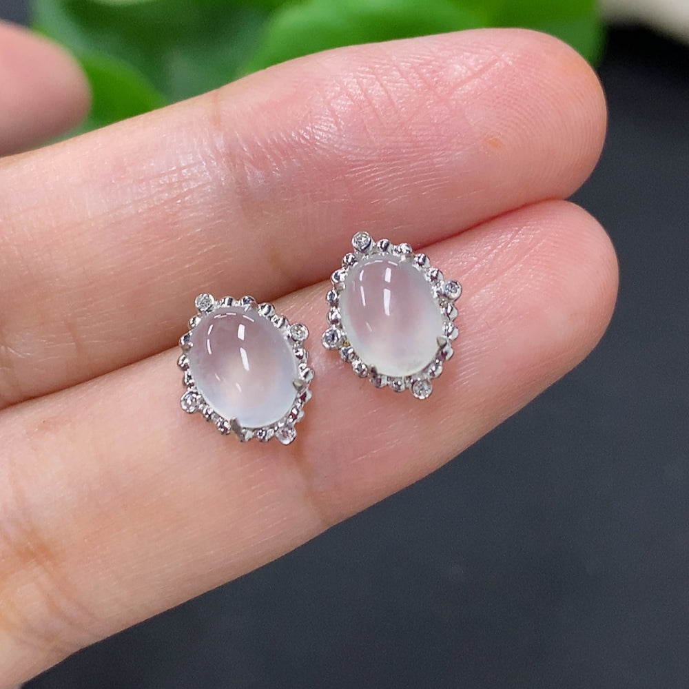 Jadeite ear studs with 18K gold accents and diamond details, HKHQ, showcasing elegant jewelry with a polished finish.