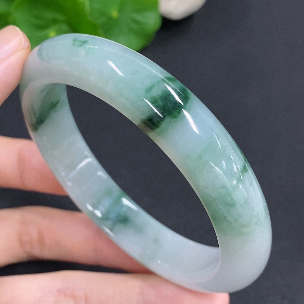 Round jadeite bangle with a 65.6g weight and size 60, showcasing smooth, polished green jadeite from HKHQ.