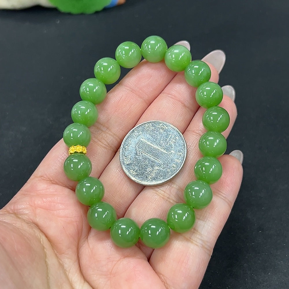 HKHQ Hetian Jade bracelet with 9.6mm beads, weighing approximately 30.1g, featuring smooth, polished jade stones.