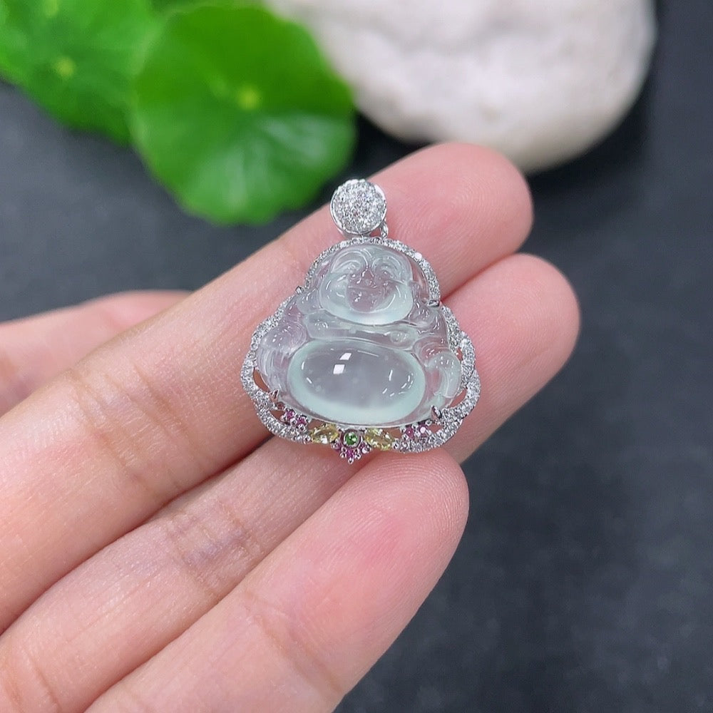Jadeite inlaid Buddha pendant in 18k gold with colorless diamond, displayed on a necklace, weighing approximately 3.63g.