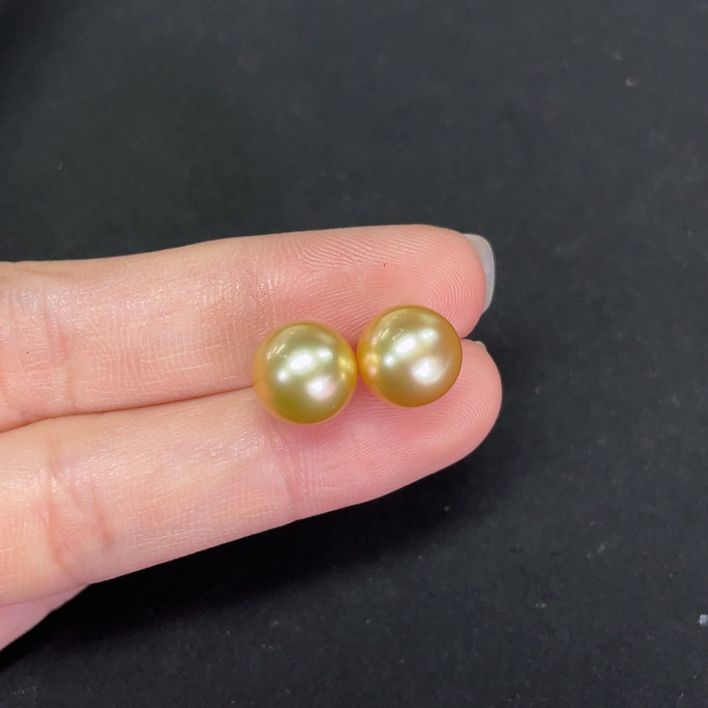 Saltwater pearl stud earrings with 14K gold setting, featuring 9.3mm pearls and a simple, elegant design.