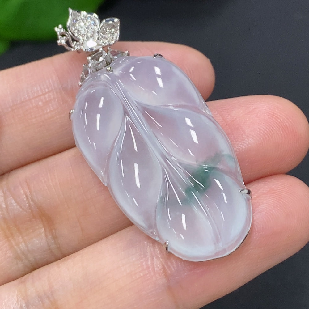 Jadeite leaf pendant necklace with 18K gold and diamond accents, elegant jewelry by HKHQ featuring a detailed leaf design.
