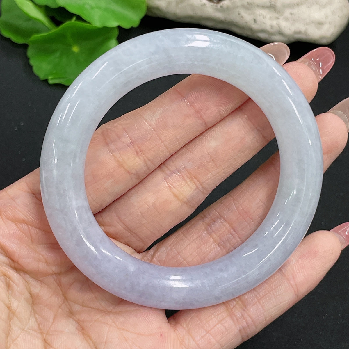 Jadeite round bangle with a 53mm size and approximately 70g weight, featuring smooth, polished green jadeite from HKHQ.