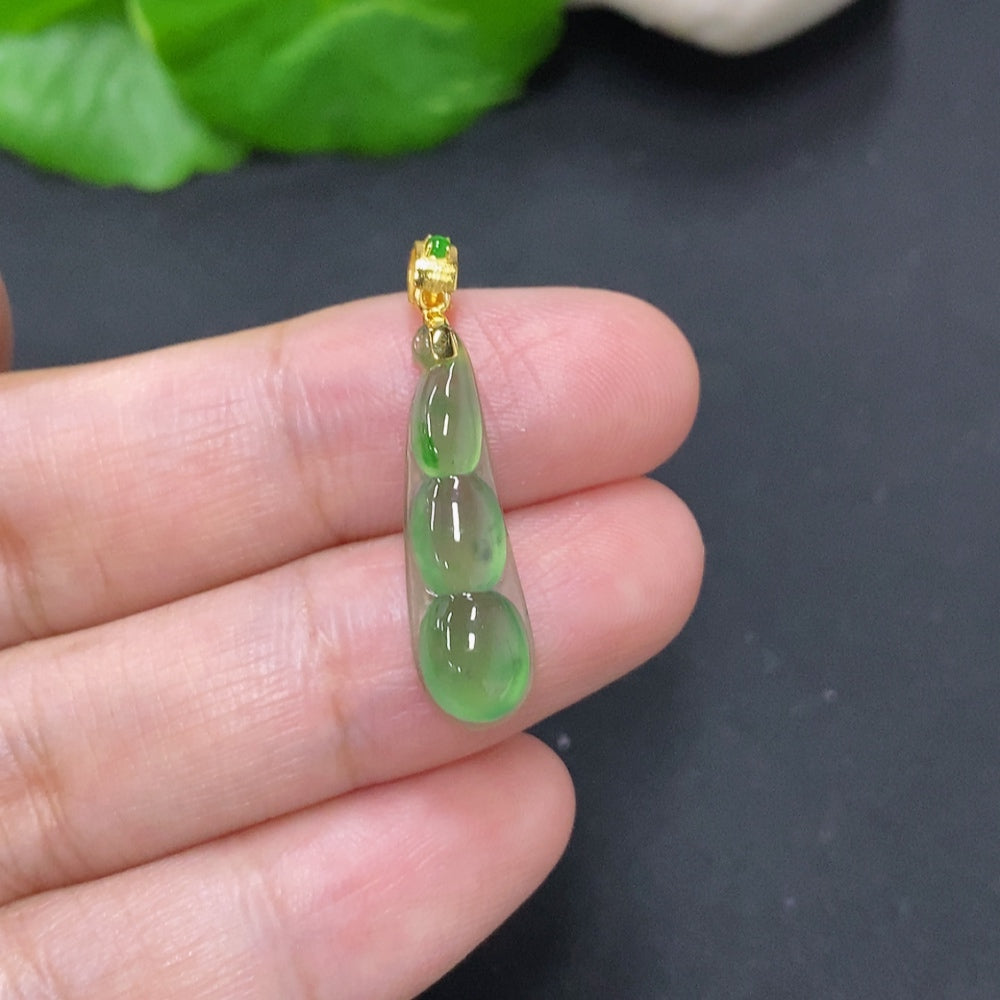 Jadeite lucky bean pendant with 18K gold clasp, smooth green jade, HKHQ brand, lightweight jewelry accessory.