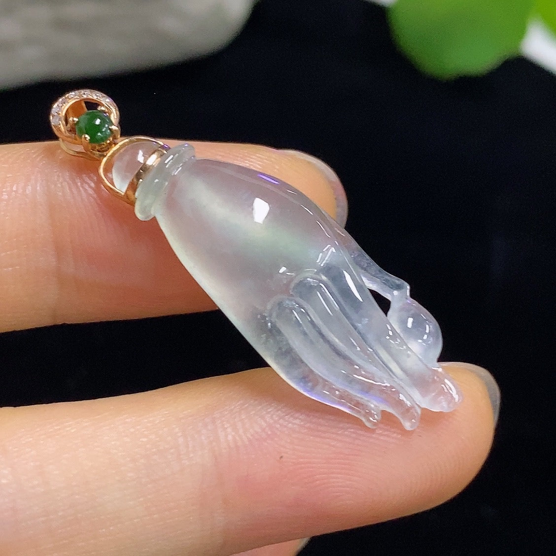 Jadeite pendant with diamond accents in 18k gold, shown on a necklace chain, weight approximately 3.53g, by HKHQ.