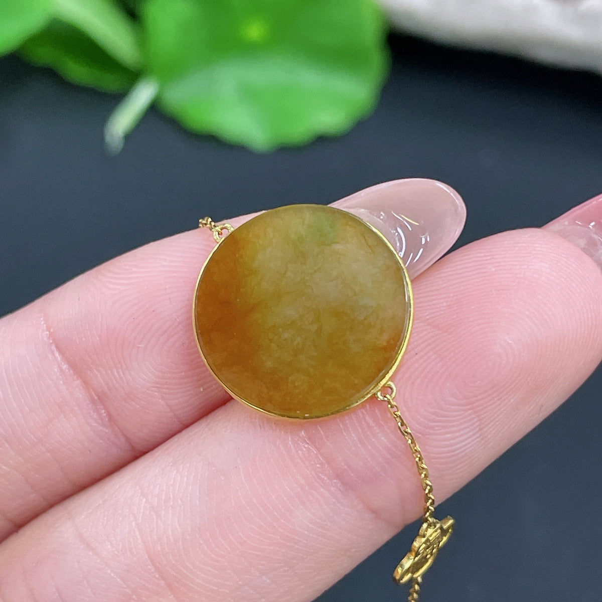 Jadeite pendant with 18k gold inlay and chain, featuring a smooth green jade stone, weight approximately 2.2g, by HKHQ.