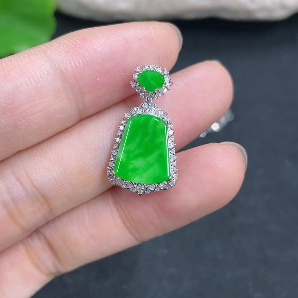 Jadeite pendant with 18K gold accents and diamond details, featuring a smooth jade surface, on a delicate chain.