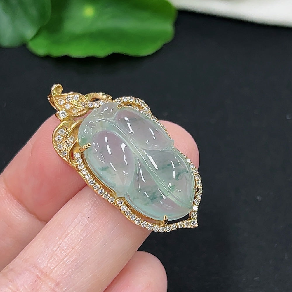 Jadeite leaf inlay pendant with diamond accents in 18K gold, weighing approximately 6.6g, from HKHQ.