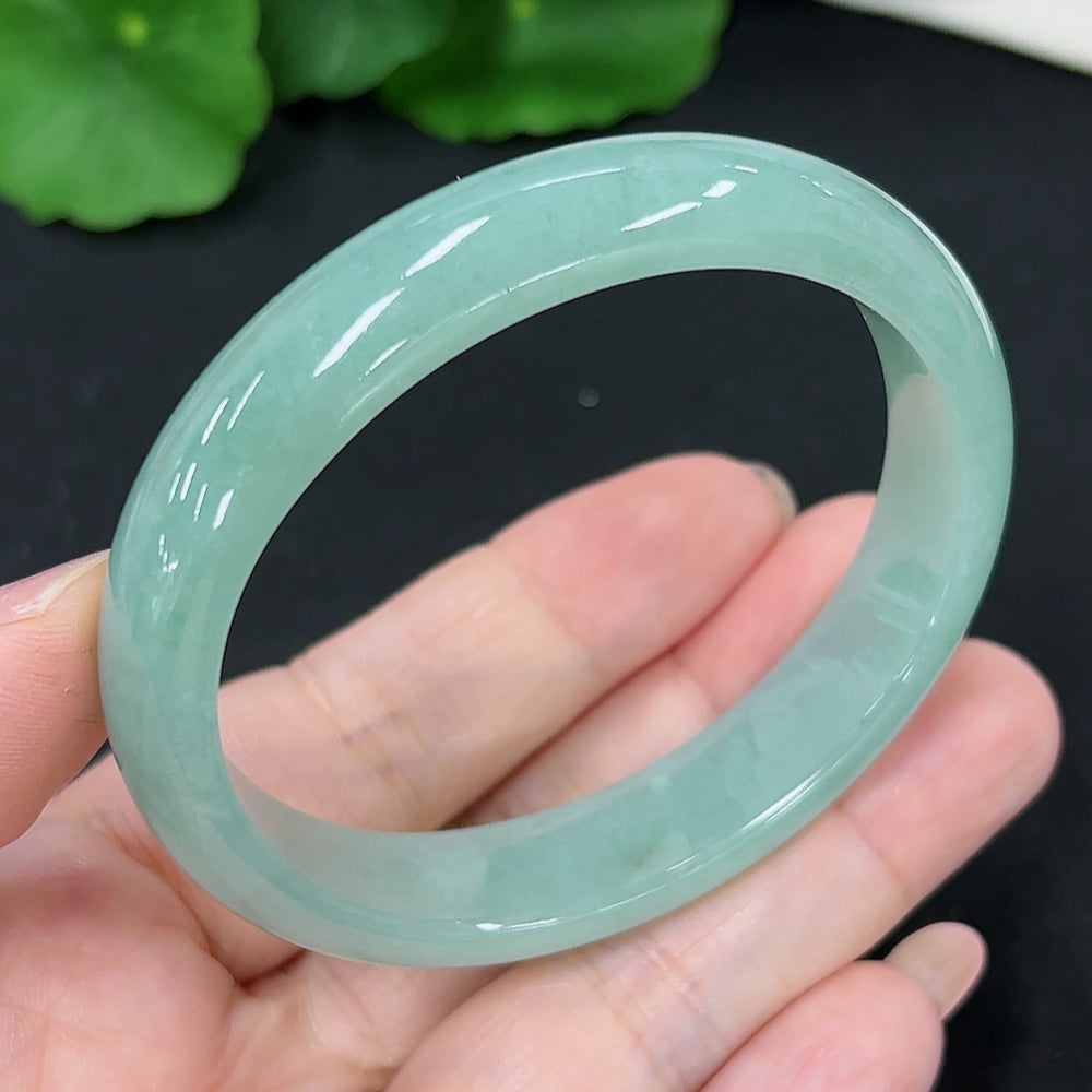 HKHQ jadeite oval bangle in size 53.2, showcasing a smooth, polished surface and elegant oval shape, weighing 37.4g.