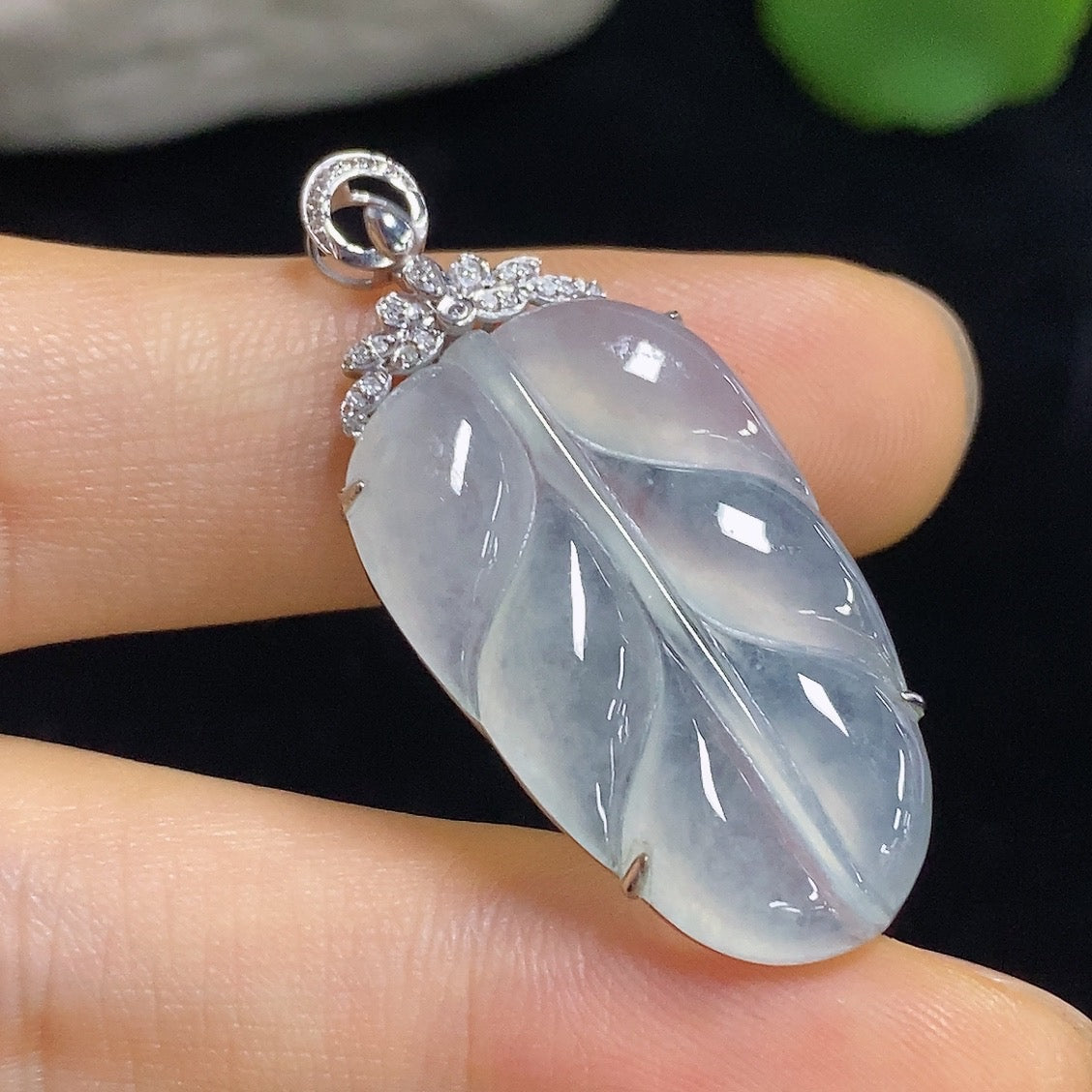 Jadeite leaf pendant with 18k gold and diamond accent, HKHQ necklace, approximately 4.5g weight, elegant jewelry piece.
