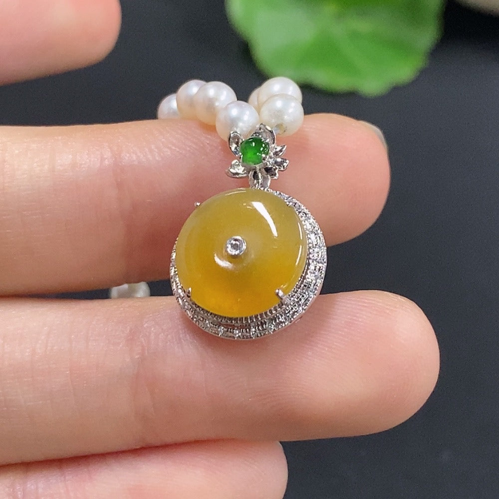 Jadeite auspicious pendant with inlay, diamonds, pearls, set in 18k pendant, featuring intricate jade and diamond details.