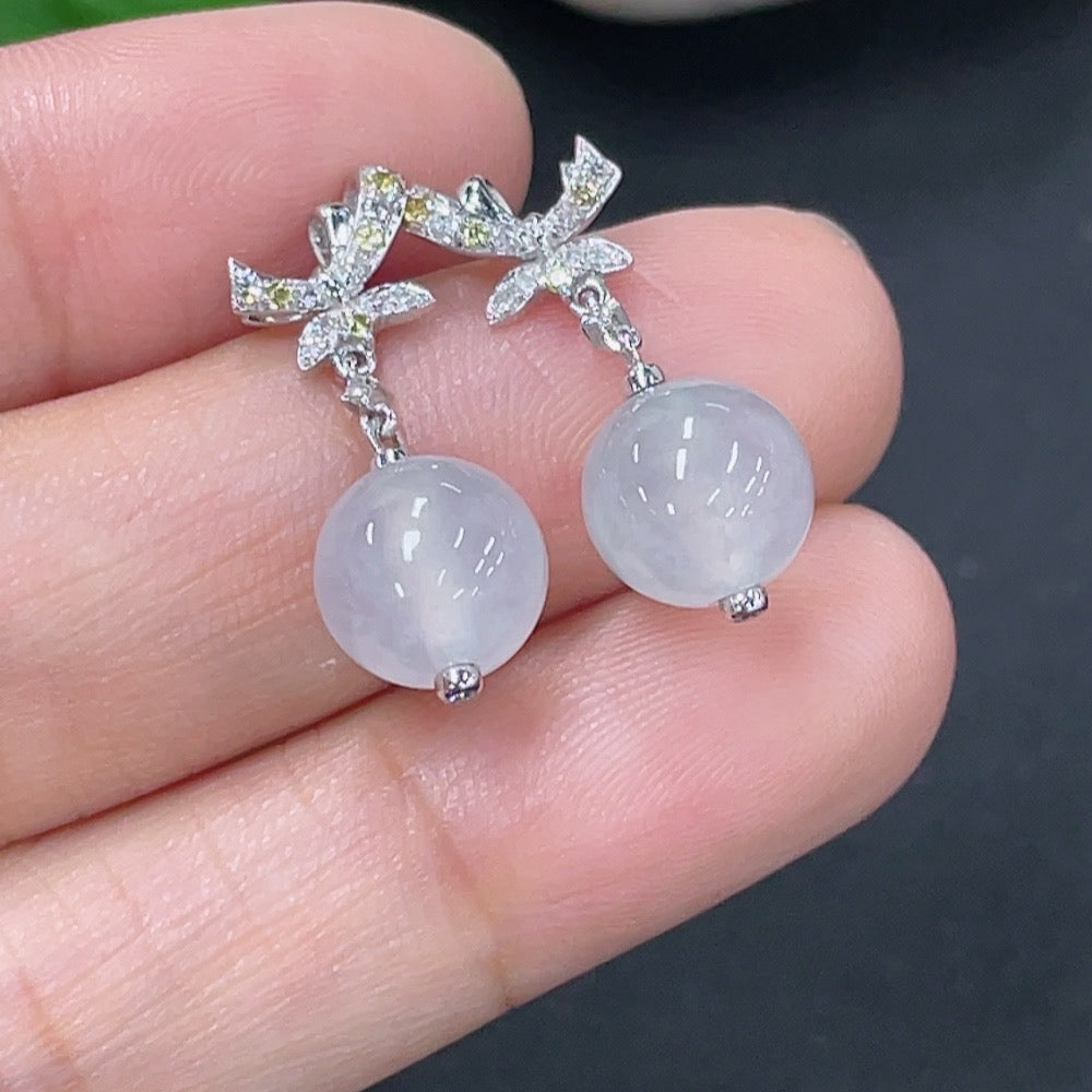 Jadeite earrings set in 18k gold with diamond accents, total product weight approximately 3.07g