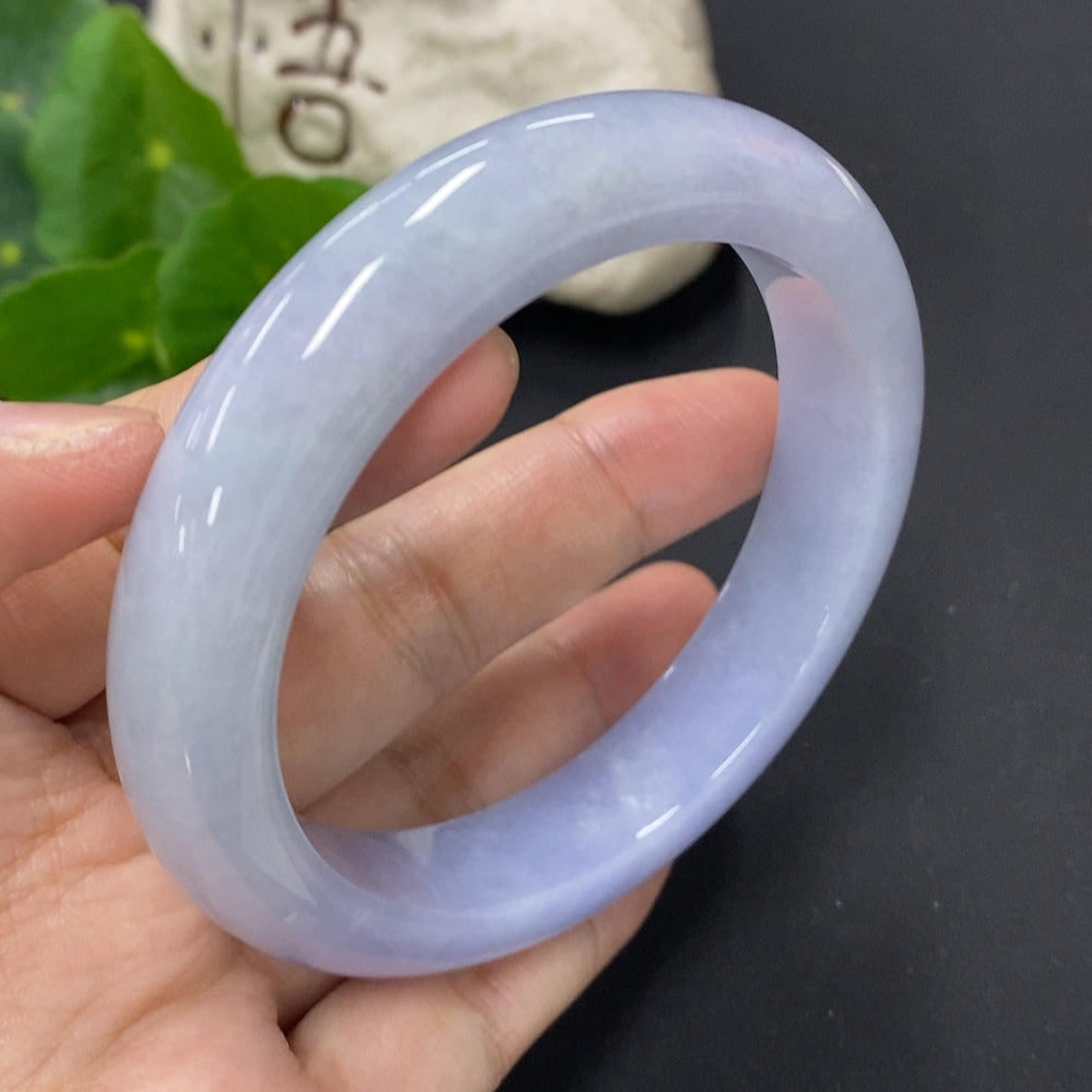 Jadeite round bangle bracelet with a size of 60.8, weighing approximately 77.3g, featuring smooth, polished jadeite surface.