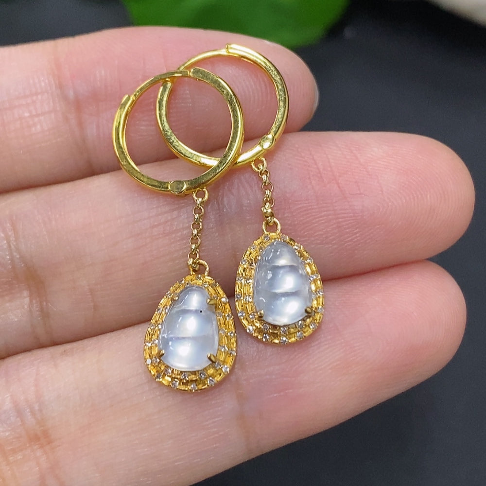 Jadeite auspicious bean earrings set in 18K gold with diamond accents, featuring smooth green jade beans in a delicate jewelry design.