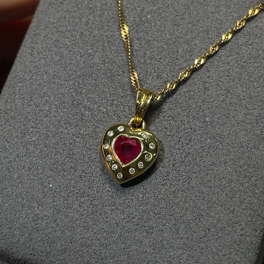 18K gold ruby pendant with diamond accents, total weight including chain approximately 4.14g