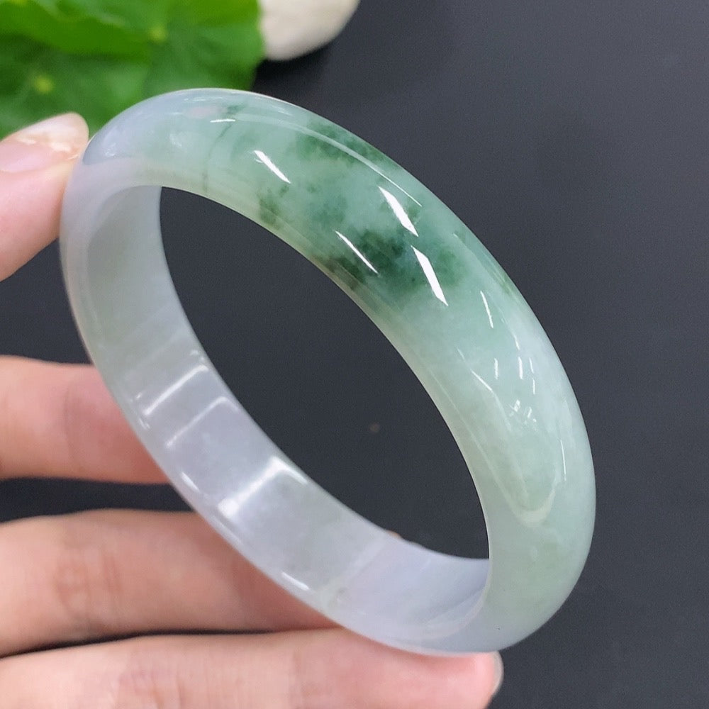 Round jadeite bangle with a 58mm size, weighing approximately 48.4g, showcasing smooth, polished jade from HKHQ.