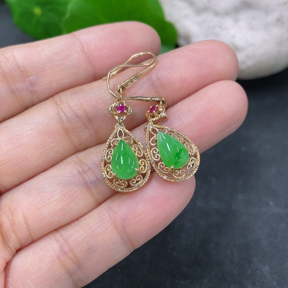 Jadeite drop earrings with 18k gold setting and diamond accents, showcasing elegant green jade and sparkling gemstones.