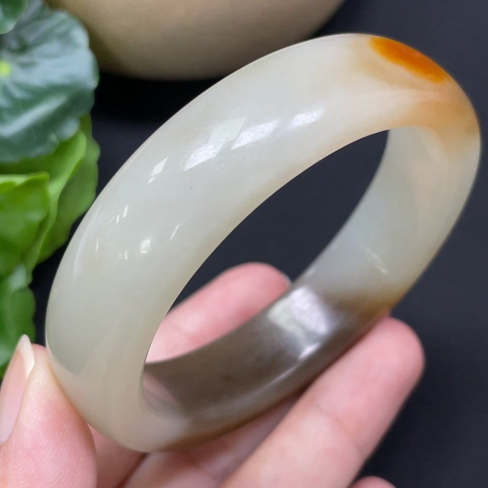 Round Hetian jade bracelet with mineral components, 55.8mm, weighing 66.44g, featuring smooth jade beads and natural mineral accents.