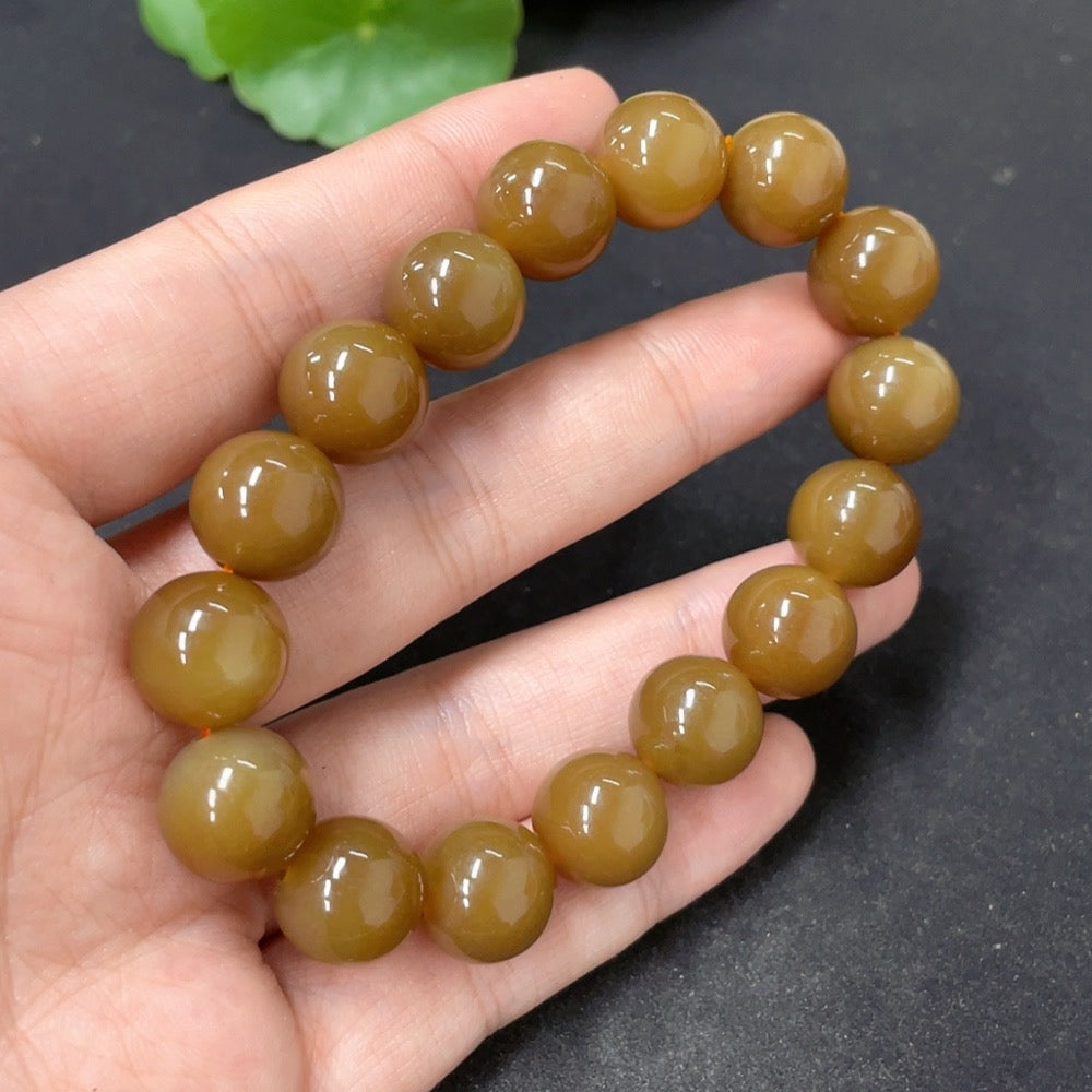 Heitian jade bracelet with 11.6mm beads, showcasing smooth green jade stones, weight approximately 42.7g, by HKHQ.
