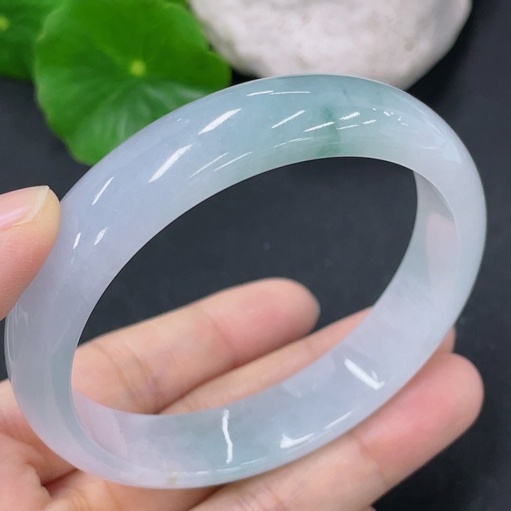 Jadeite round bracelet in size 54.8mm, weighing approximately 42.48g, featuring smooth, polished jade stones.