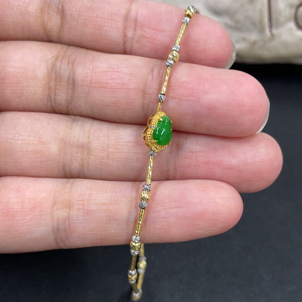 HKHQ Jadeite Gourd bracelet with 18k gold inlay and diamond accents, showcasing intricate craftsmanship and elegant design.