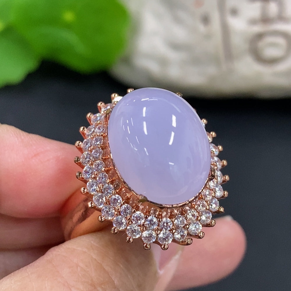 Jadeite cabochon with non-gold inlay, weighing approximately 20.8g, showcasing smooth, polished green jade from HKHQ.